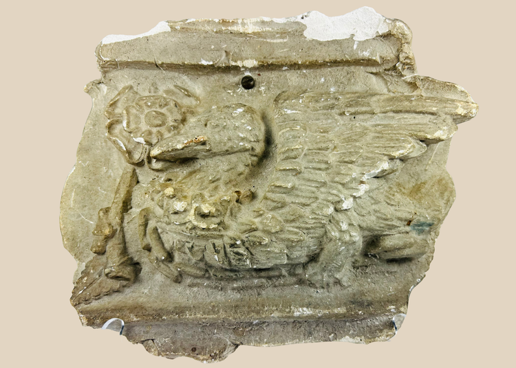 Early 20th-century plaster relief of a medieval griffin with wings, referencing Westminster Coronation 1902