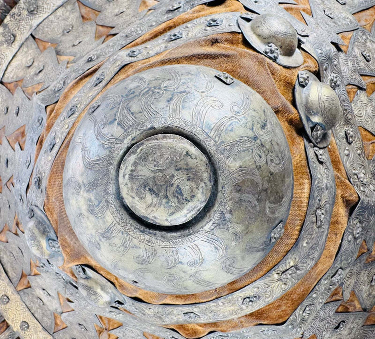 Detail of the large central boss with radiating foliate decoration on an Ethiopian shield