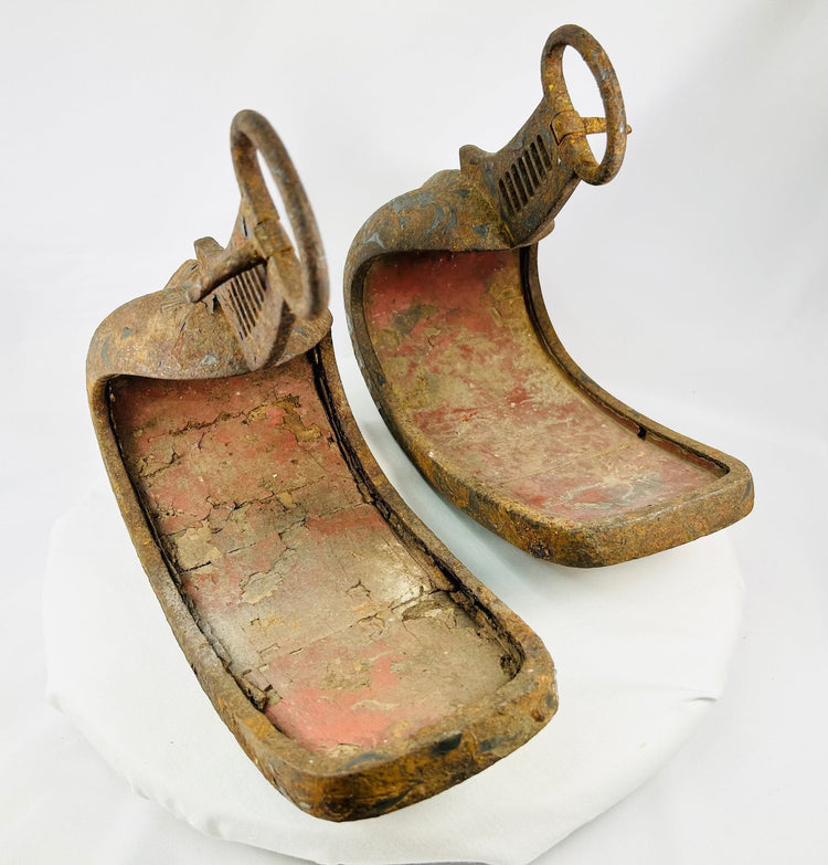 Historic Japanese abumi stirrups crafted for mounted archery, featuring ladder-slotted risers and hand-forged iron construction.