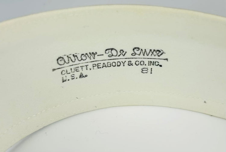 Edwardian collar box with ornate exterior and preserved linen collars
