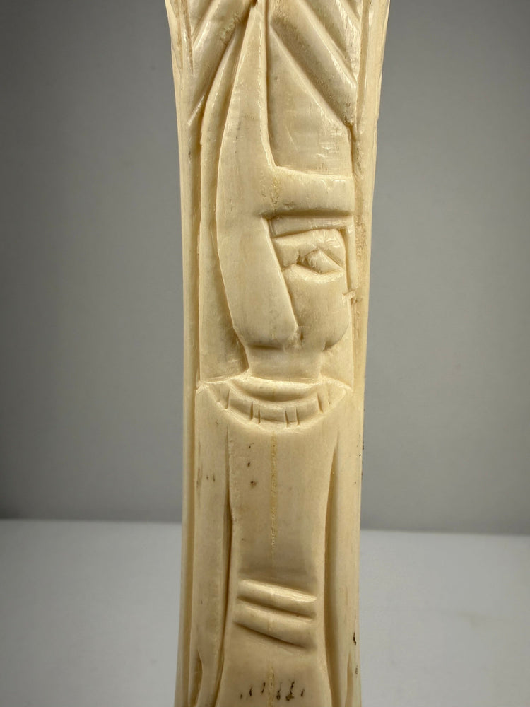 Antique carved bone candlesticks with lotus and papyrus symbolism from early 20th-century Egypt