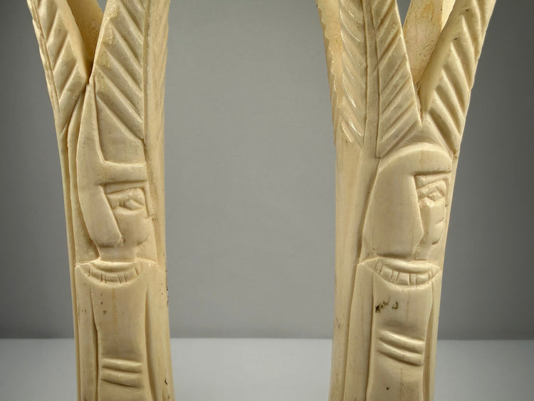 Hand-carved bone candlestick holders from Egypt with stylized lotus and papyrus forms