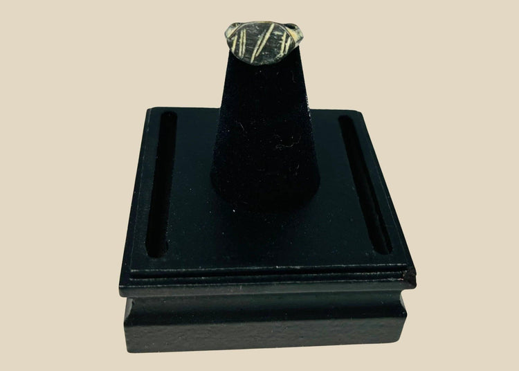 Ancient Roman bronze ring, circa 2nd century AD, featuring an engraved intaglio personal seal with geometric linear design; worn patina and age-related surface wear highlight its use as a functional signet ring within the Roman Empire.
