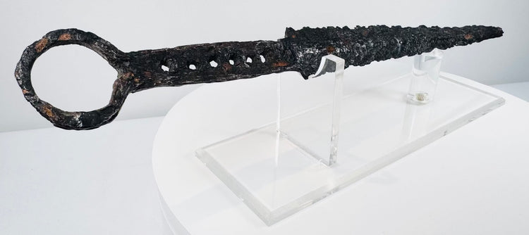 Close view of antique quillon dagger showing centuries-old patina, corrosion and medieval ironwork