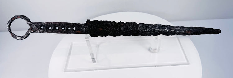 Antique medieval quillon dagger with tapered thrusting blade and distinctive circular ring pommel
