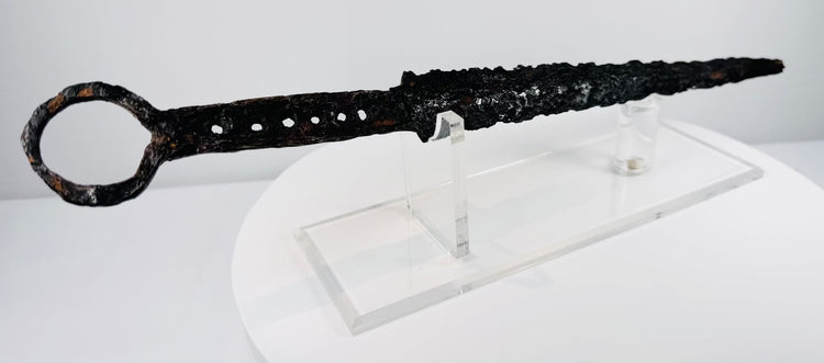 Rare medieval European dagger with forged blade, pierced grip section and circular iron pommel