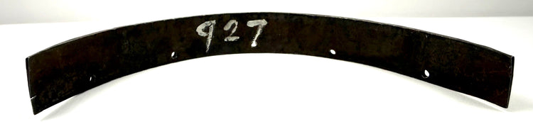 Reverse side of antique steel armor band marked with inventory number 927 and rivet holes