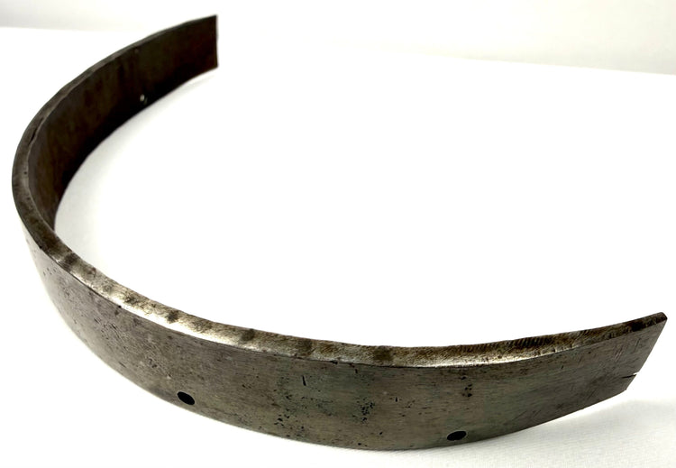 Dark grey metallic forged steel armor band with visible surface texture and circular holes