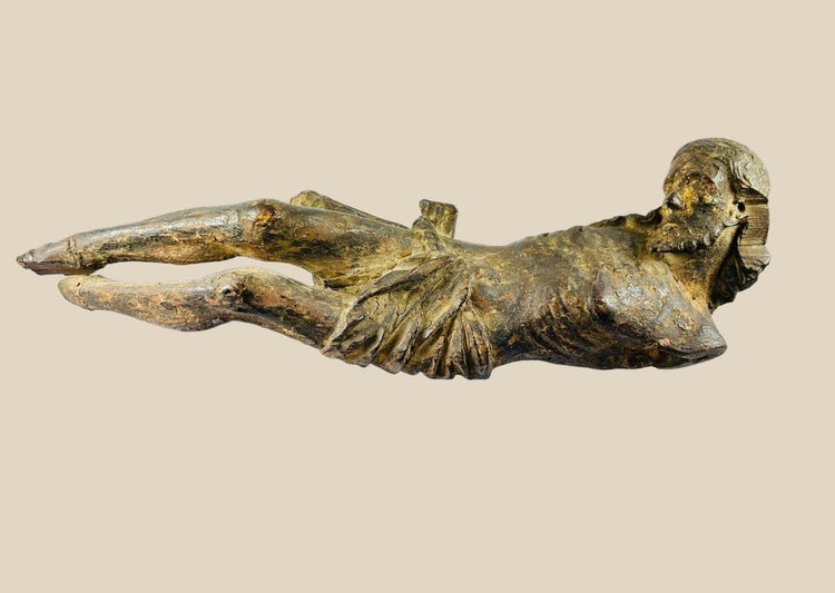 Hand-carved 17th-century Baroque wooden crucifix depicting Christ with expressive features and natural patina, suitable for devotional or display purposes.