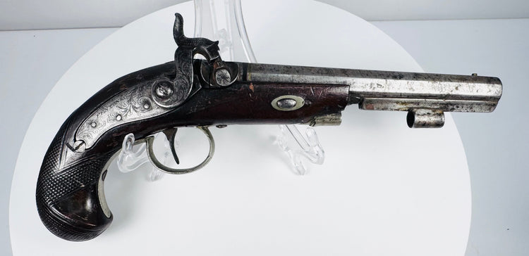Fenton of London antique pistol showing aged steel barrel and finely shaped walnut stock
