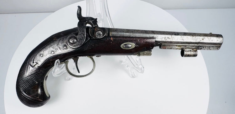 Fenton of London antique pistol showing aged steel barrel and finely shaped walnut stock
