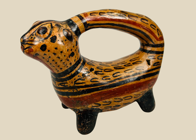 Pre-Columbian feline effigy rattle vessel with arching handle and painted slip design, Costa Rica, 800–1200 CE
