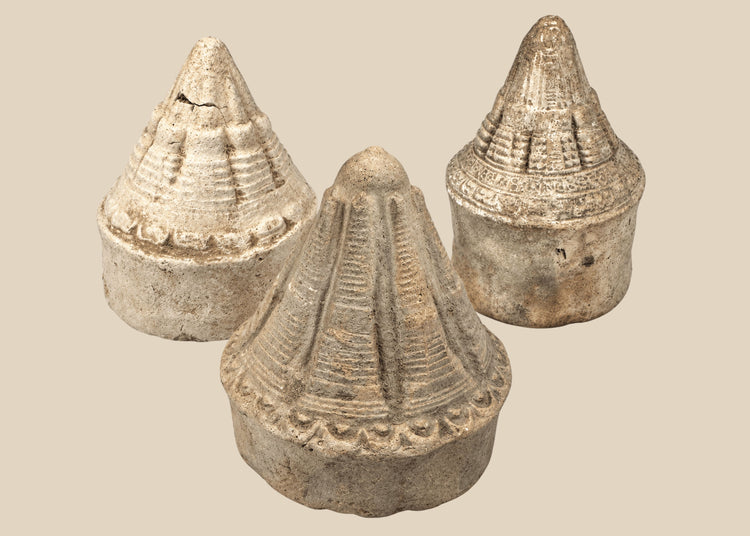 Three Eastern Indian Buddhist terracotta votive stupas with tiered conical forms, circa 8th–12th century CE