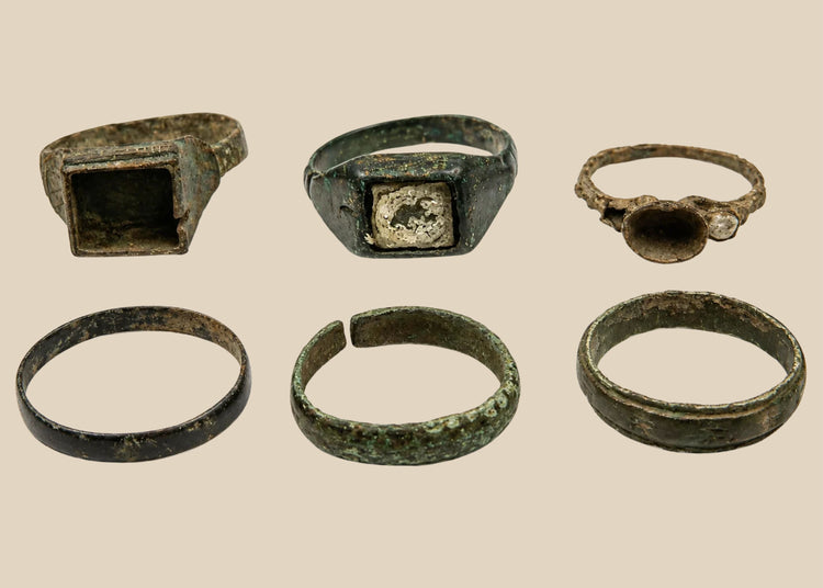 Group of six Late Roman to Early Byzantine bronze finger rings with varied bezel and band designs, circa 3rd–7th century CE