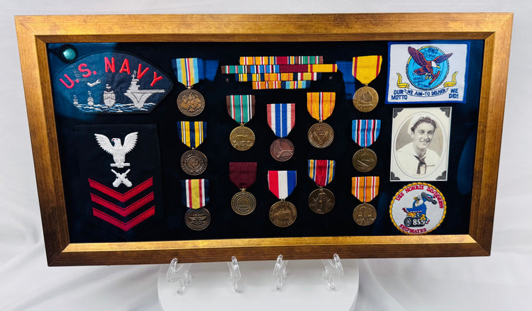 Historic U.S. Navy shadow box showcasing military service memorabilia and decorations