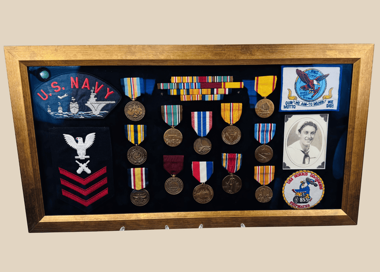 Framed U.S. Navy veteran shadow box featuring medals, patches, ribbon bars, and portrait photograph