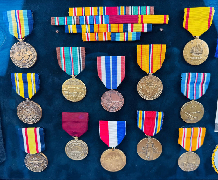 Vintage American naval service shadow box with embroidered patches and commemorative decorations