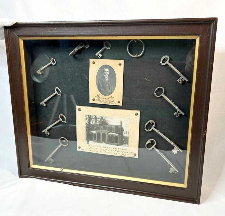 19th-century framed display with antique iron keys and portrait
