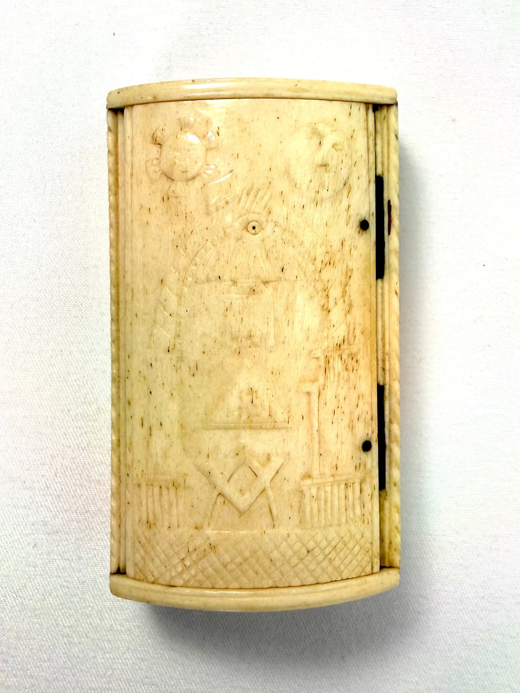 Hand-carved bone snuff box decorated with the Masonic Square and Compasses, All-Seeing Eye, and celestial symbols.