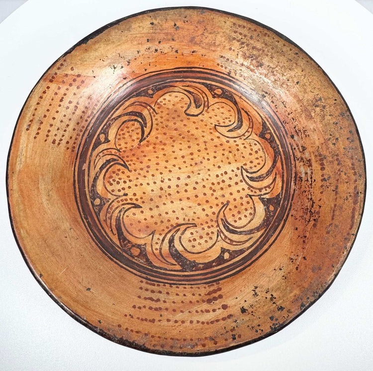 Oblique view of Pre-Columbian Central American ceramic bowl displaying painted interior and shallow profile