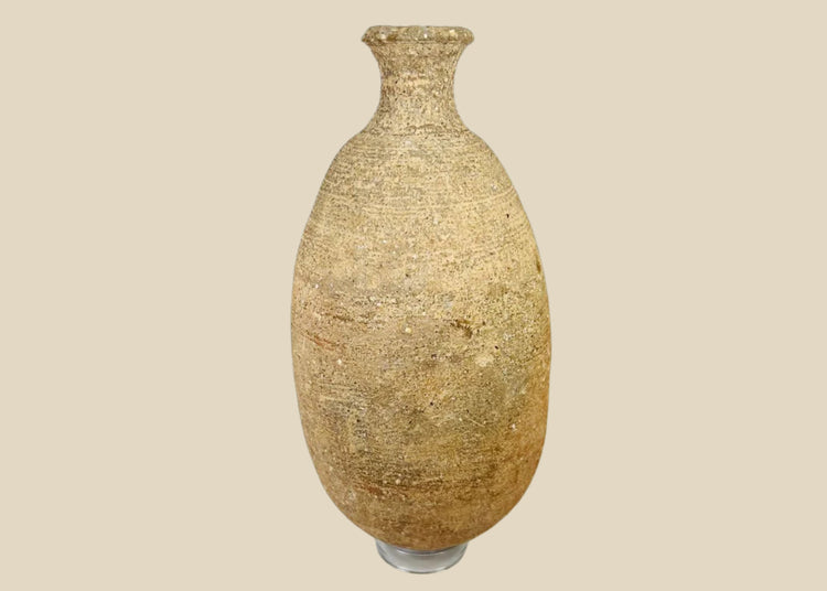 Ancient Greco-Roman terracotta storage amphora, circa 1st–3rd century CE, tall vessel with narrow neck and aged earthen patina.