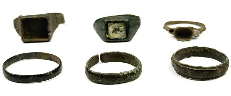 Six ancient bronze finger rings including square bezel, inset, round bezel and plain band forms from the Roman and Byzantine periods