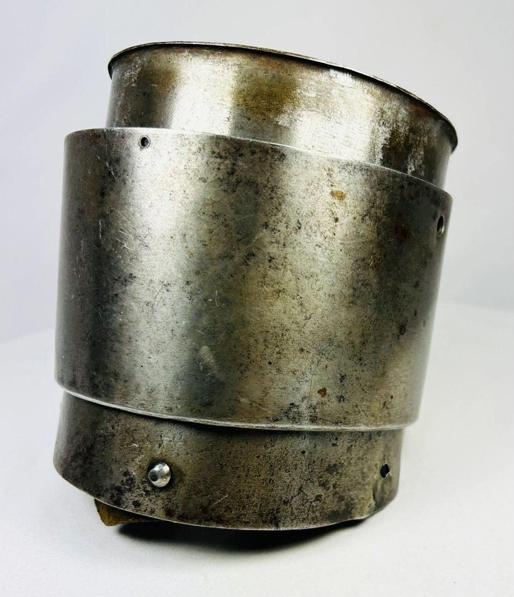 17th-century European siege armour arm guard, crafted from metal with riveted construction and aged patina from historic use.