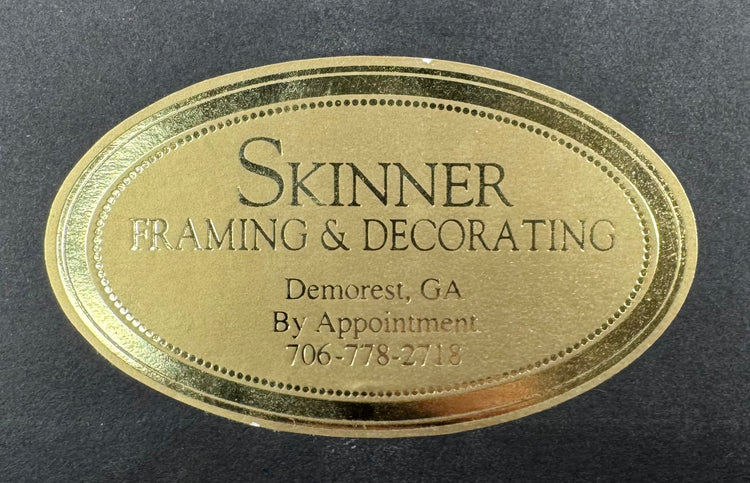 Skinner Framing and TruGuard conservation labels on the reverse of the framed manuscript