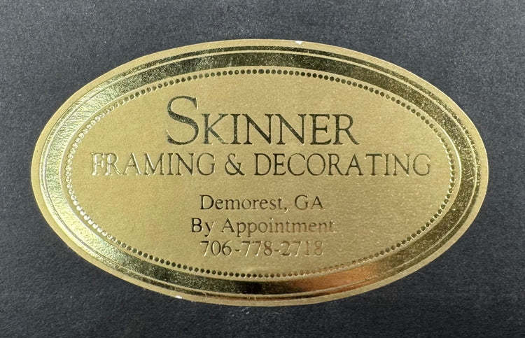 Skinner Framing and TruGuard conservation labels on the reverse of the framed manuscript