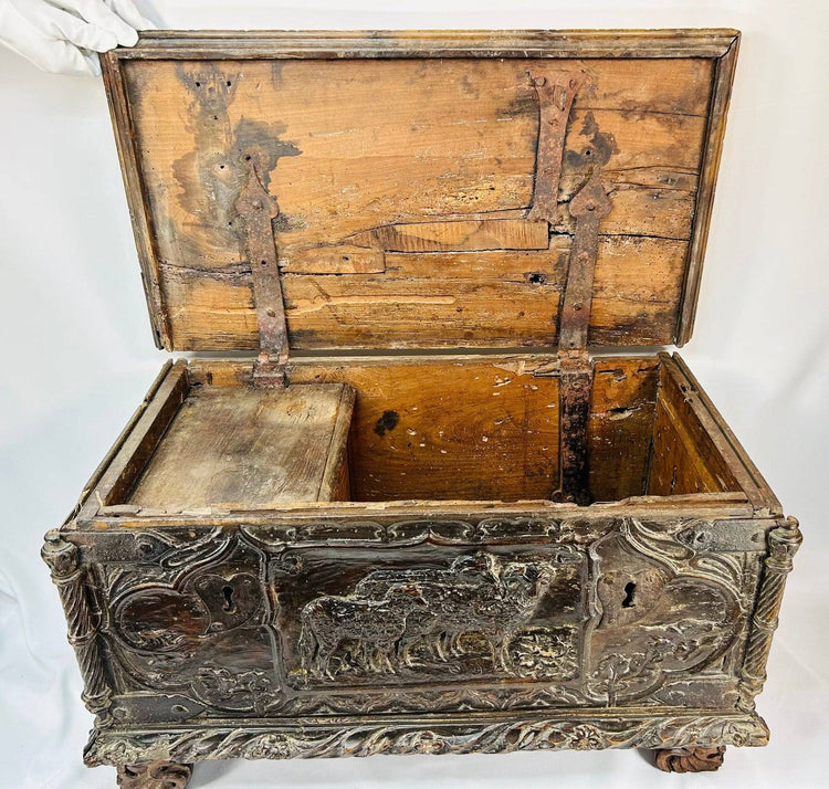 Renaissance Italian domestic art chest featuring carved pastoral imagery and foliate scroll ornamentation