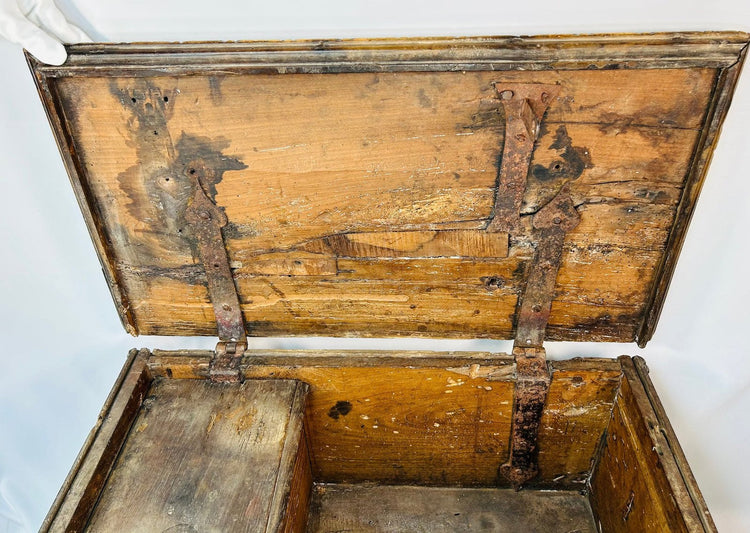 Historic Italian forziere chest with classical motifs, narrative lid carving, and traditional side till interior