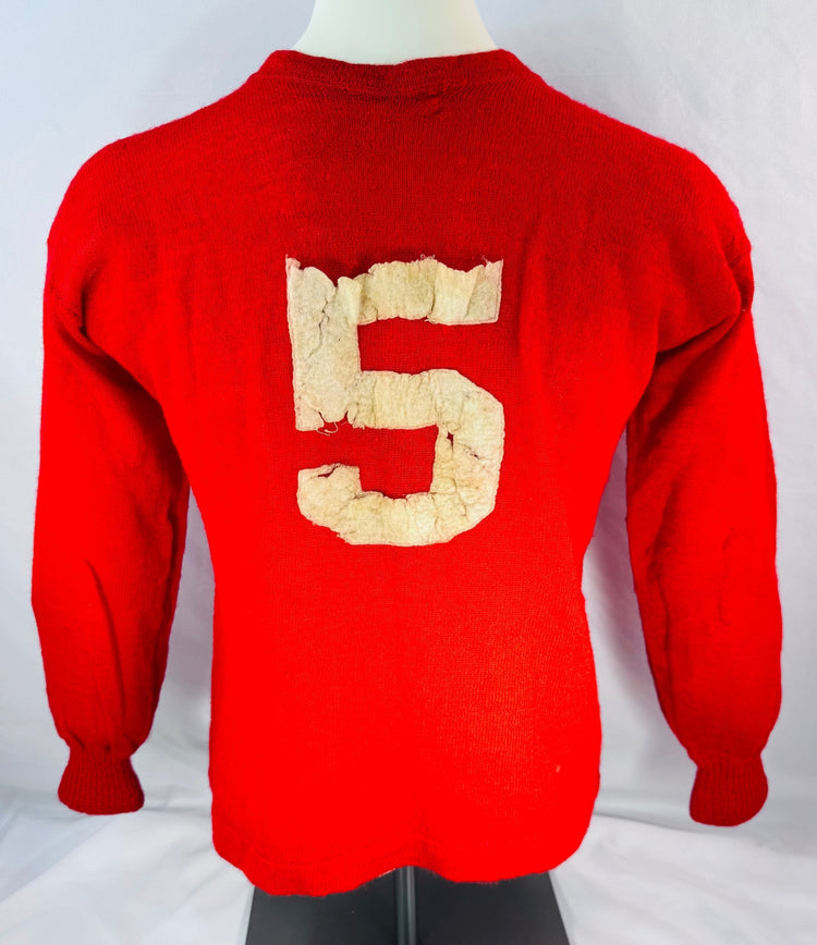 Reverse view of red Sages hockey sweater displaying applied number 5