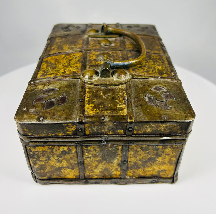 Antique Eastern European iron reinforced valuables chest with mottled gilt metal panels and working lock, circa 1800–1830.