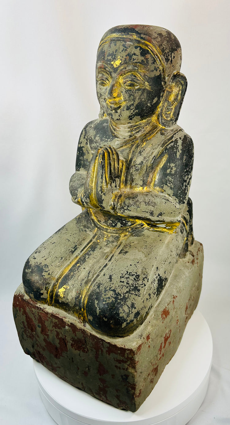 Mandalay period Burmese carved wooden devotee figure with traces of lacquer and gilding.