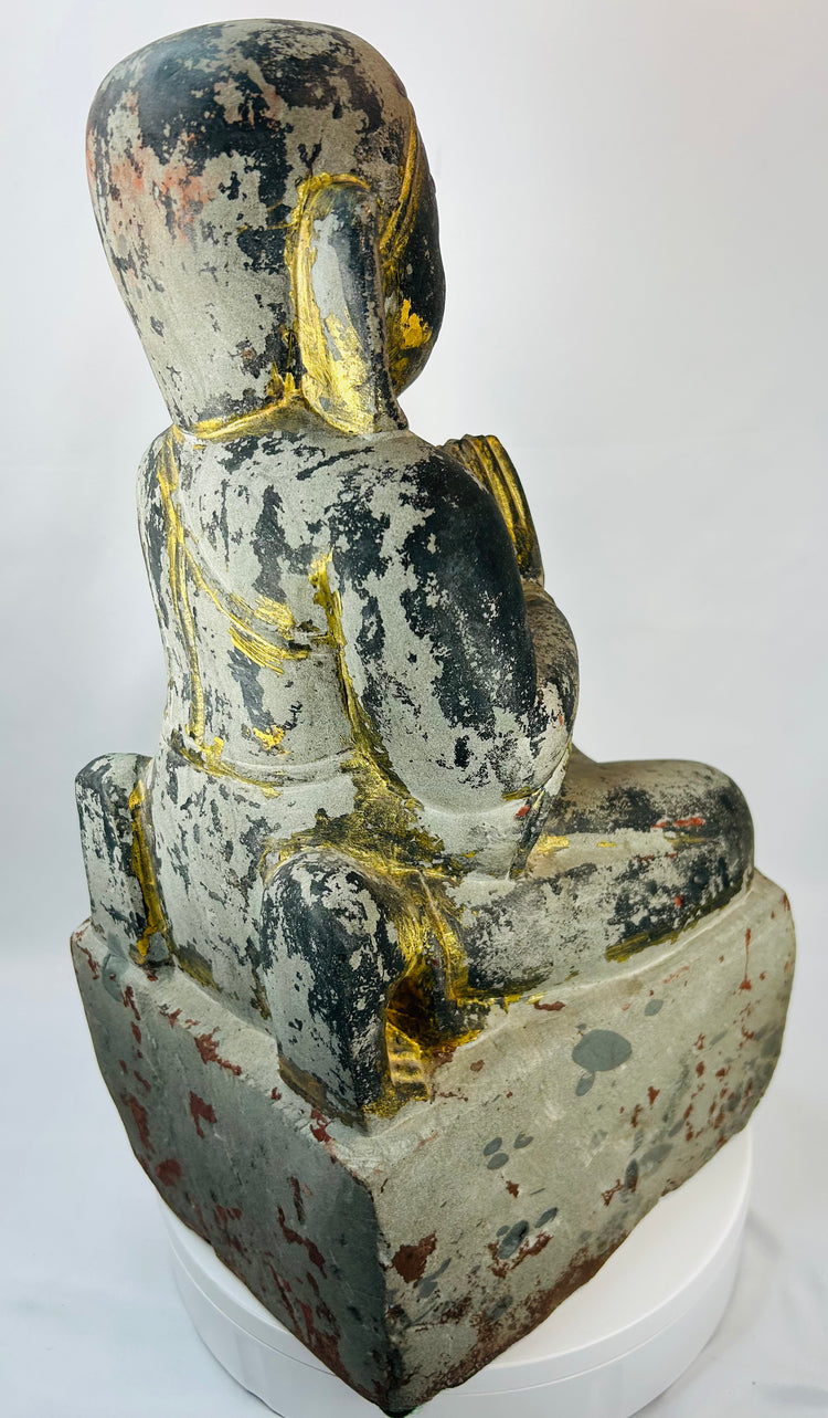 Burmese carved wooden temple attendant figure kneeling in reverence before Buddha.