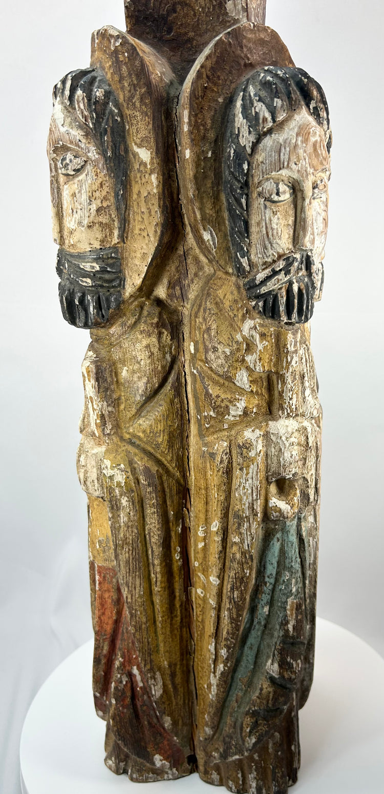 Spanish Colonial altar or retablo column sculpture with haloed saint figures.