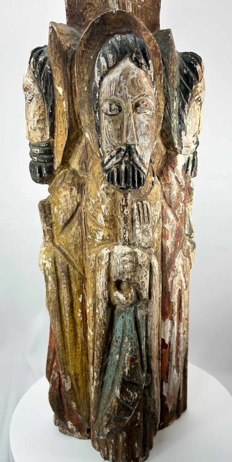 Antique Spanish Colonial religious sculpture with four standing saints and traces of pigment.