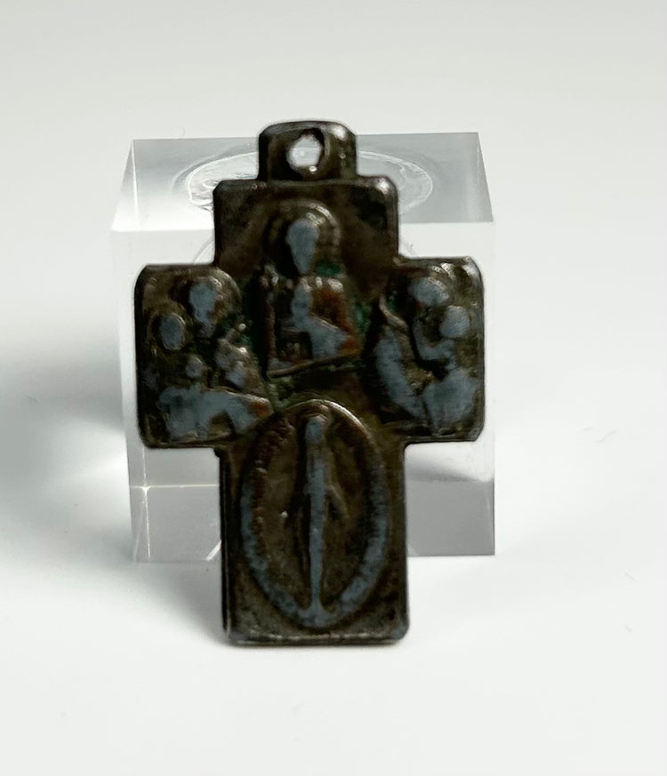 historic bronze crucifix pendant with Christian religious iconography and suspension loop, likely European 19th century devotional artifact