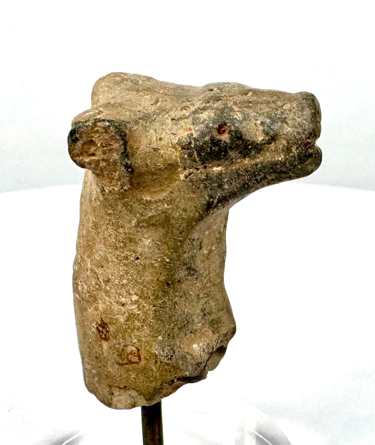 Roman Imperial terracotta female head, circa 70–120 CE, featuring an elaborate Flavian-inspired hairstyle and finely modelled facial features.