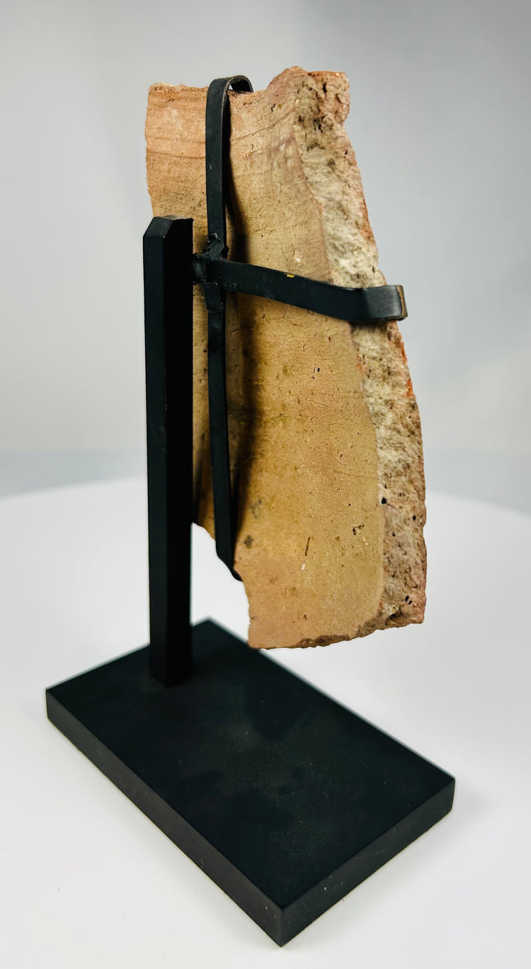 Fragment of ancient theatrical mask made of terracotta from the Mediterranean world circa 2nd century BCE–2nd century CE.