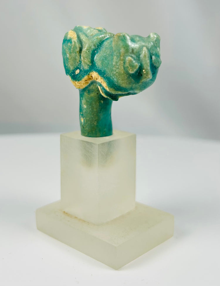 Blue-green Egyptian faience handle fragment featuring feline head of goddess Bastet from the Late Period.