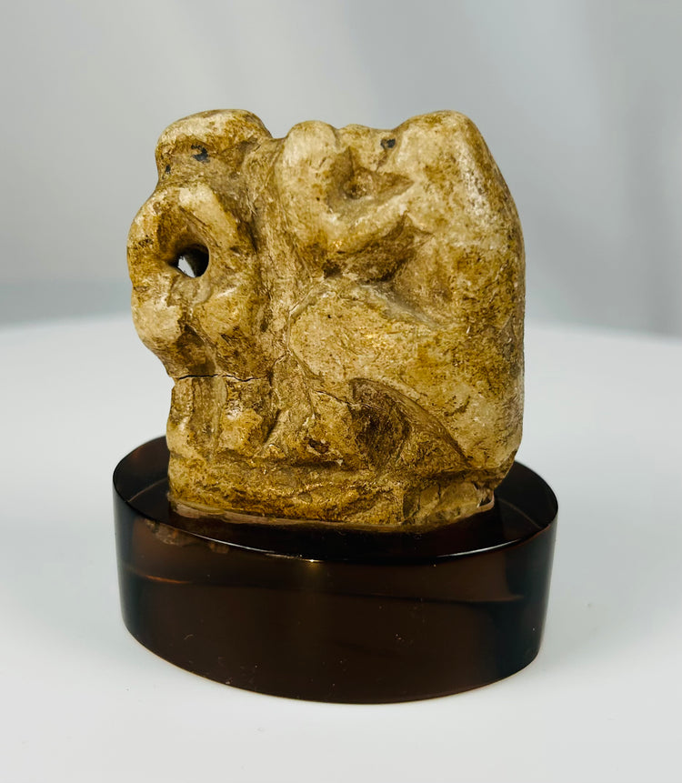 Small Egyptian limestone sculpture of a sacred baboon representing the deity Thoth.