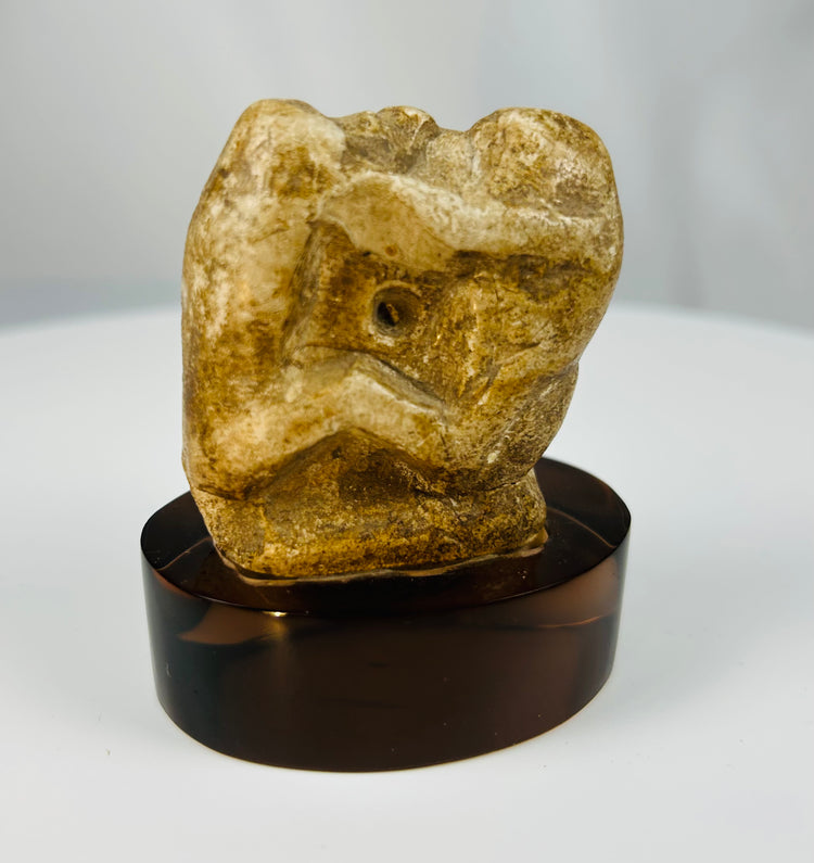 Carved limestone baboon figurine from ancient Egypt with archaeological patina.