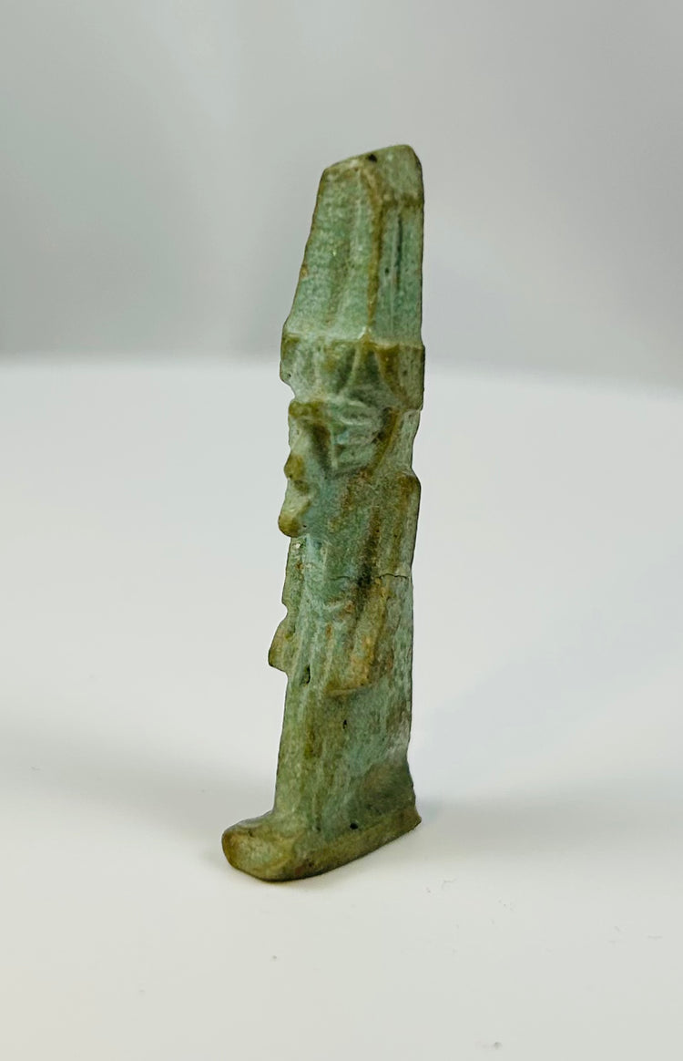Egyptian faience amulet of Nefertem mounted on display stand from the Late Period.