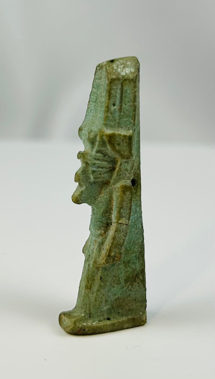 Ancient Egyptian protective amulet of Nefertem with characteristic lotus crown.