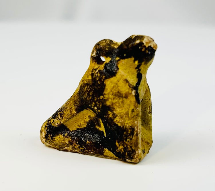 Late Period Egyptian falcon amulet symbolizing the sky god Horus.