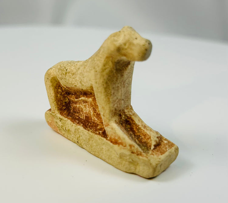 Ancient Egyptian lioness votive figure carved in limestone with natural patina.