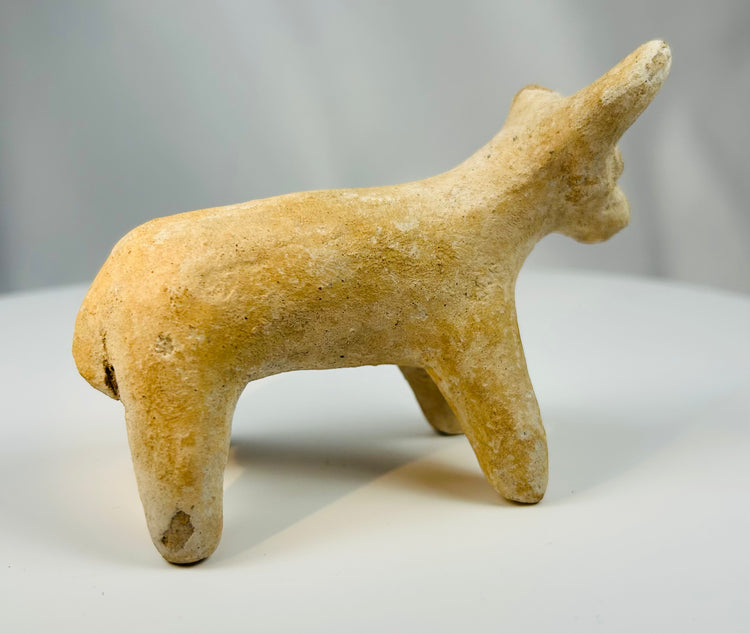 Small ancient Iranian terracotta bull sculpture with natural earthen patina.