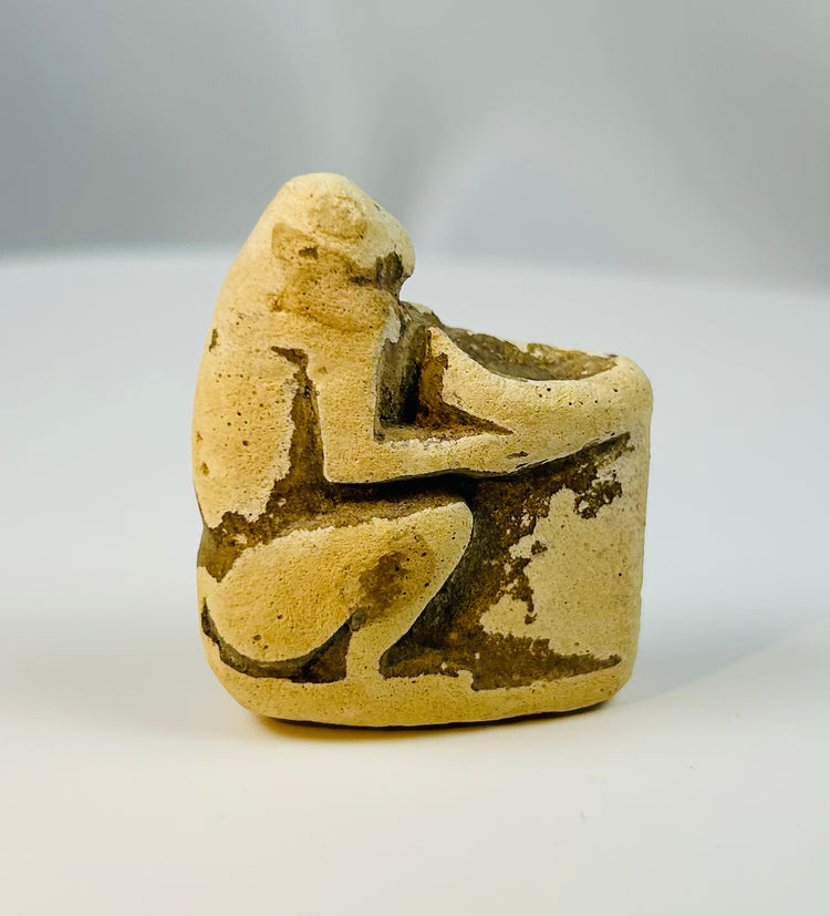 Egyptian limestone baboon figure with small ritual basin, Late Period to Ptolemaic era devotional object