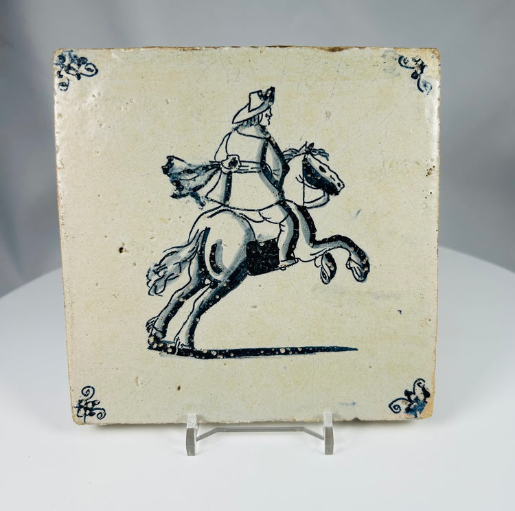 Dutch tin glazed Delft tile with hand painted horseman motif